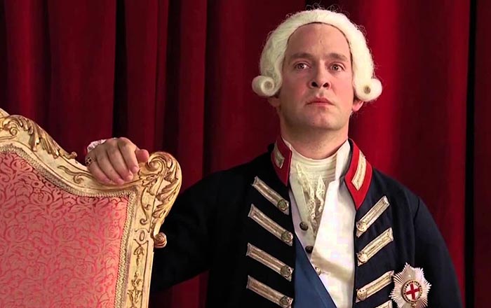 Том Холландер в роли Георга III