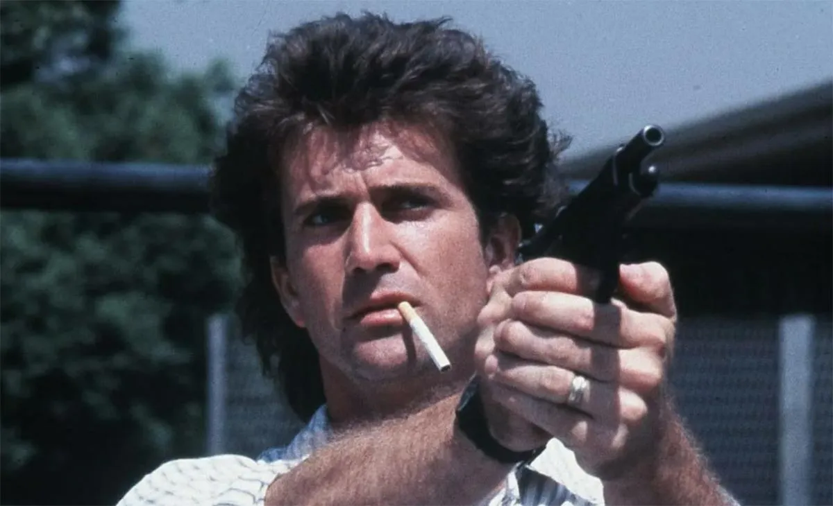 Мел Гибсон в фильме Смертельное оружие Мел Гибсон в фильме Смертельное оружие